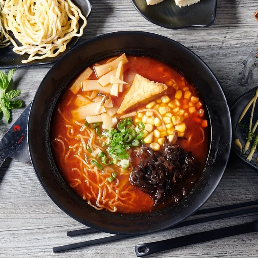 Savory oven backed tomato ramen with corn, bamboo shoots and toppings at RAMEN OSAKA, a Ramen Restaurant in San Jose