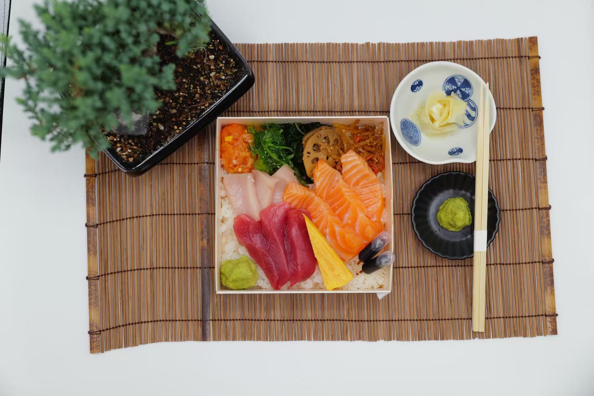 Premium fresh sashimi set with side dishes and condiments at Raw N Dash, a Japanese Restaurant in Diamond Bar