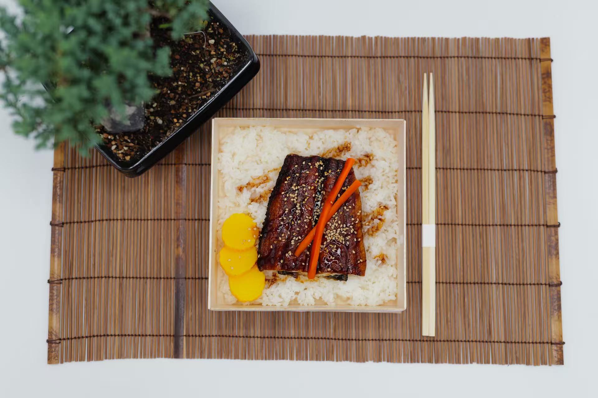 Grilled eel with sweet sauce served over steamed rice at Raw N Dash, a Japanese Restaurant in Diamond Bar