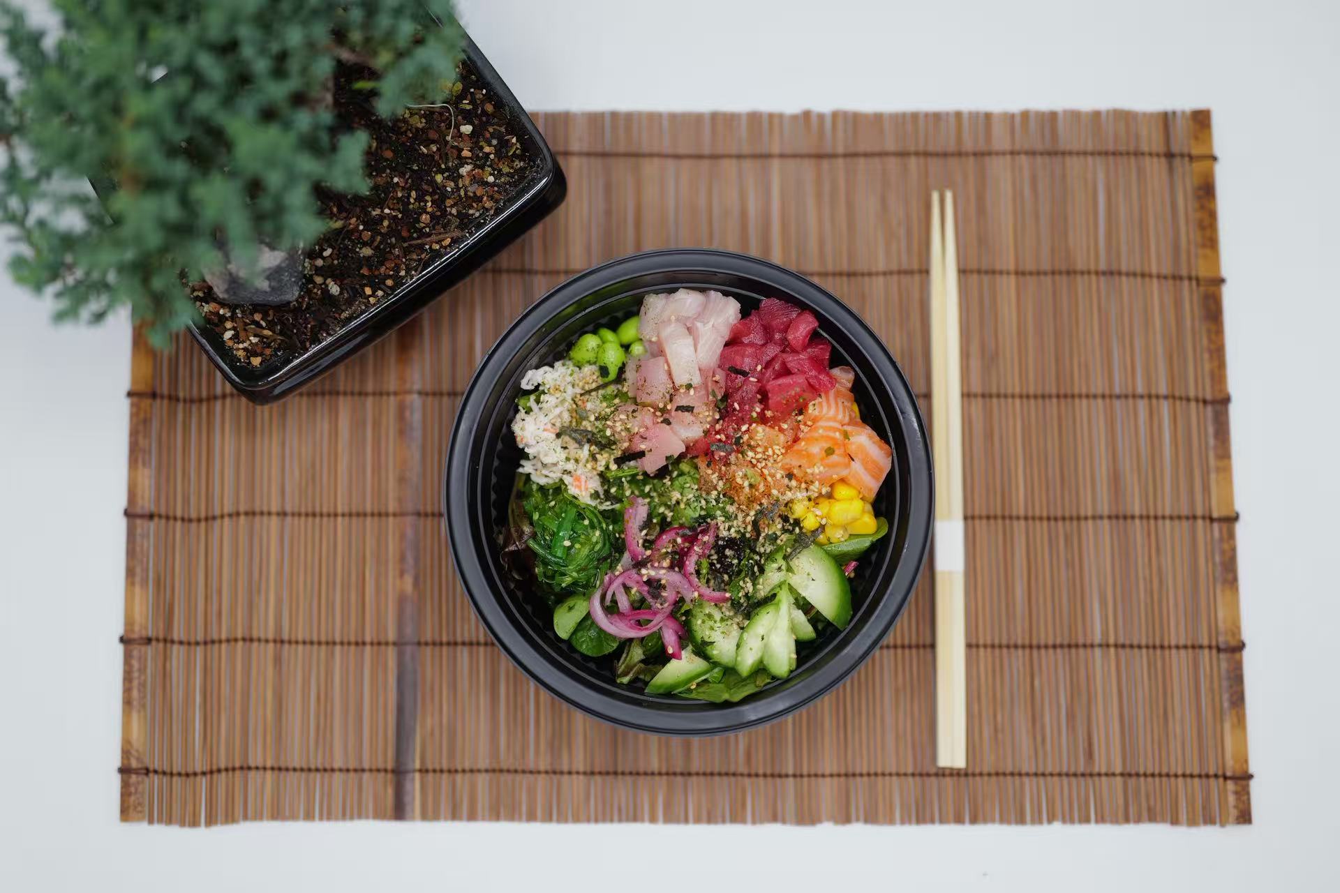 Fresh fish poke bowl with veggies, seaweed & sesame seeds at Raw N Dash, a Japanese Restaurant in Diamond Bar