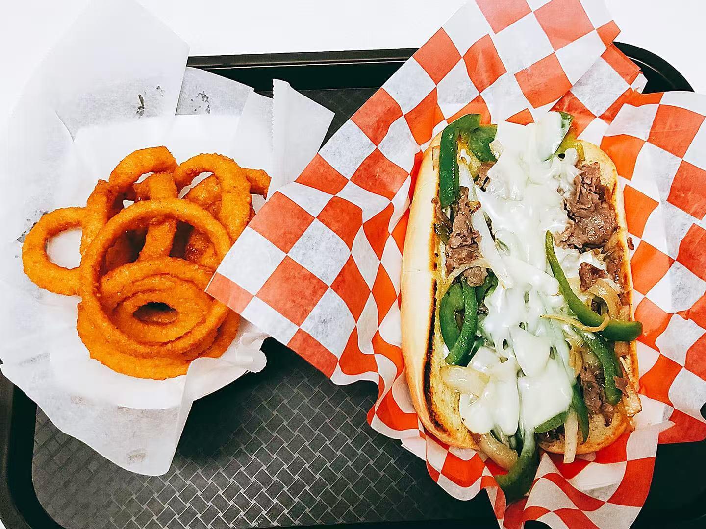 R-Burger-N-Wings-Fast-Food-restaurant-Philly-Cheesesteak-Set-Bradenton Philly Cheesesteak Set Cheesesteak sandwich with onion rings at R Burger N Wings, a Fast Food restaurant in Bradenton