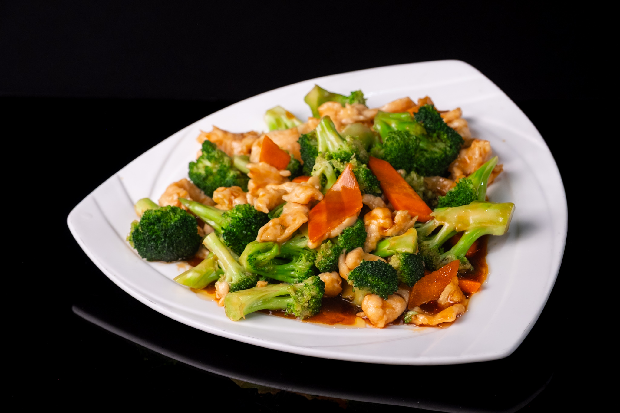 Chicken and broccoli stir-fry with carrots in savory sauce at Red Apple Buffet, a Buffet restaurant in Chicago