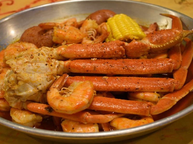 A seafood boil with crab legs and shrimp at Red Crab, an Seafood Restaurant in Melbourne