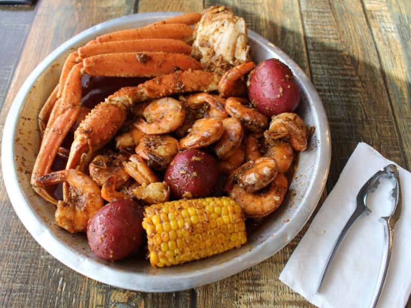 A seafood boil with crab legs, shrimp, potatoes and corn at Red Crab, an Seafood Restaurant in Melbourne