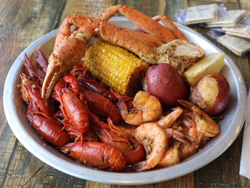 A seafood boil with crawfish, crab legs, shrimp, corn and potatoes at Red Crab, an Seafood Restaurant in Melbourne