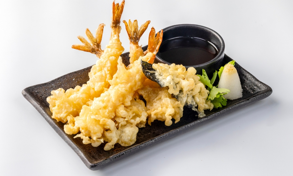 Shrimp tempura served with dipping sauce at Red Door Asian Bistro & Hibachi, an Asian Restaurant in Fort Lauderdale