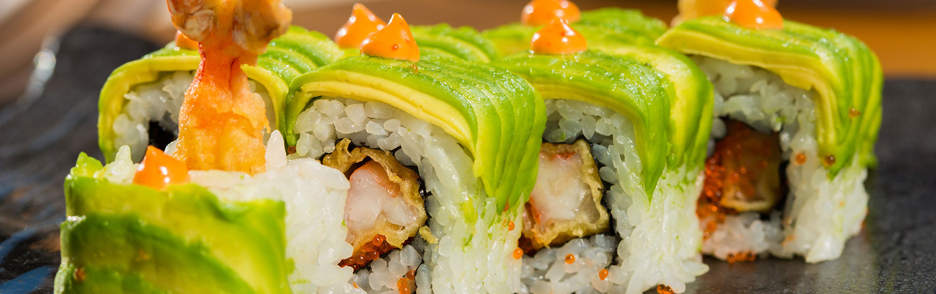 Avocado wrapped tempura shrimp sushi roll with orange roe at Red Door Grill Asian Bistro Restaurant in Wainscott