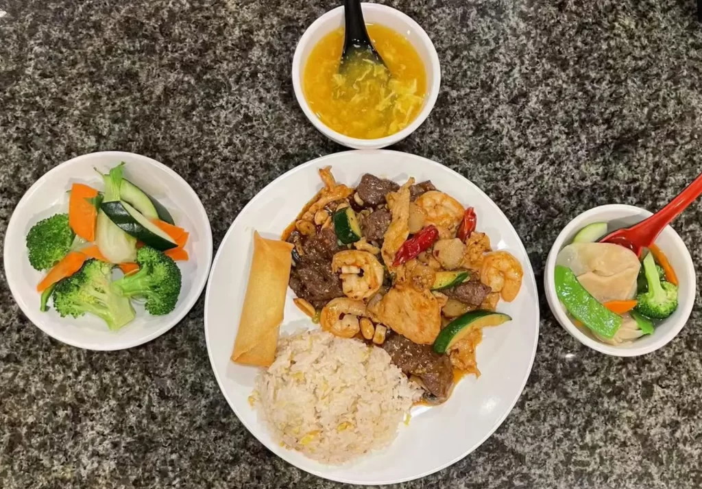 Combo platter with rice, egg drop soup and mixed meat seafood at Red Ginger China Bistro, a Chinese Restaurant in Corona