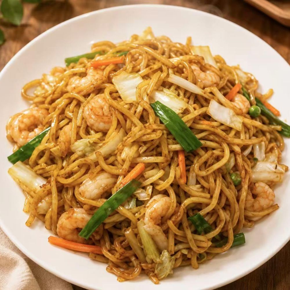 Stir-fried noodles with shrimp, cabbage, and carrot strips Stir-fried noodles with shrimp, cabbage, and carrot strips