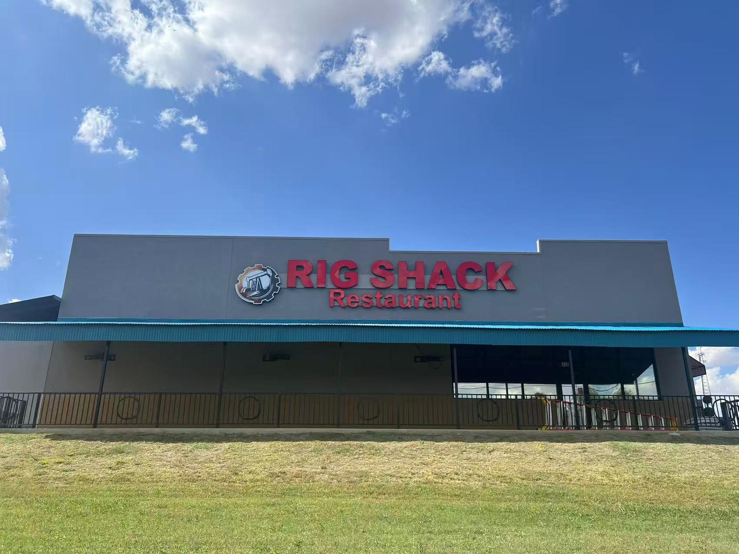 Rig Shack Restaurant storefront in Odessa, Texas under a bright blue sky with outdoor entrance view