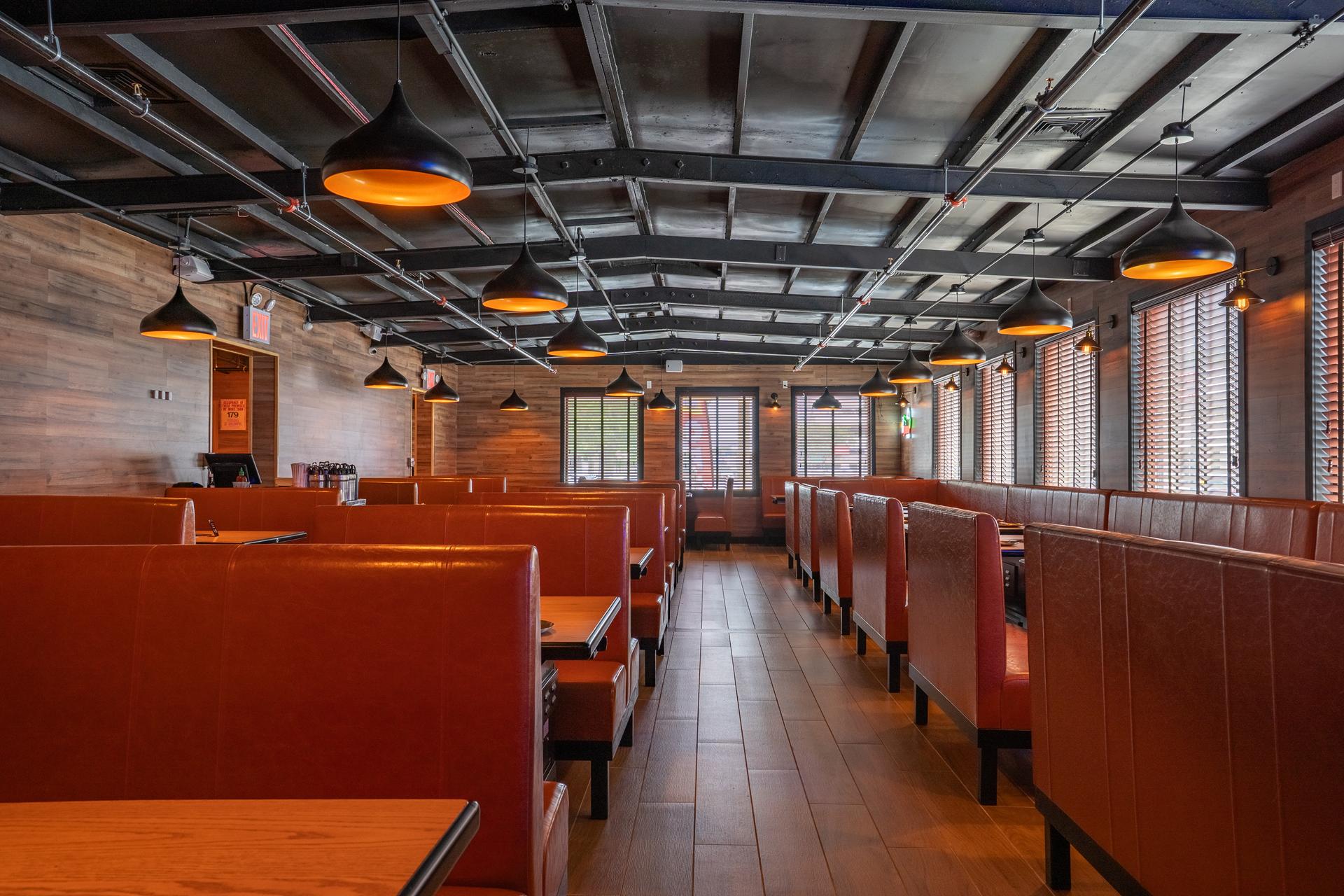 Decorative Wall with Chinese Characters, Round Mirror, and Warm Lighting in Little Skewer Restaurant