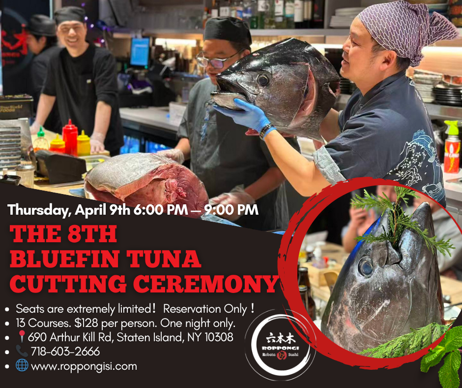 Chefs present a large bluefin tuna at a sushi bar for a special cutting ceremony event