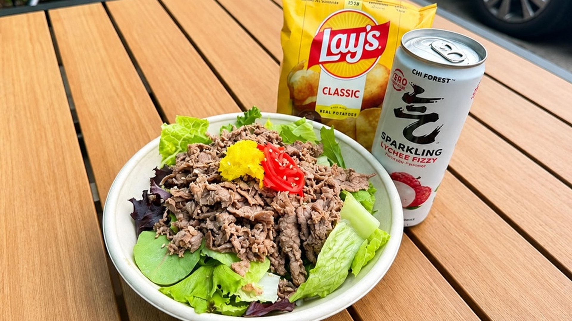 Beef poke bowl with potato chips and lychee sparkling drink at Sakana Western, a Hawaiian Restaurant in Chicago