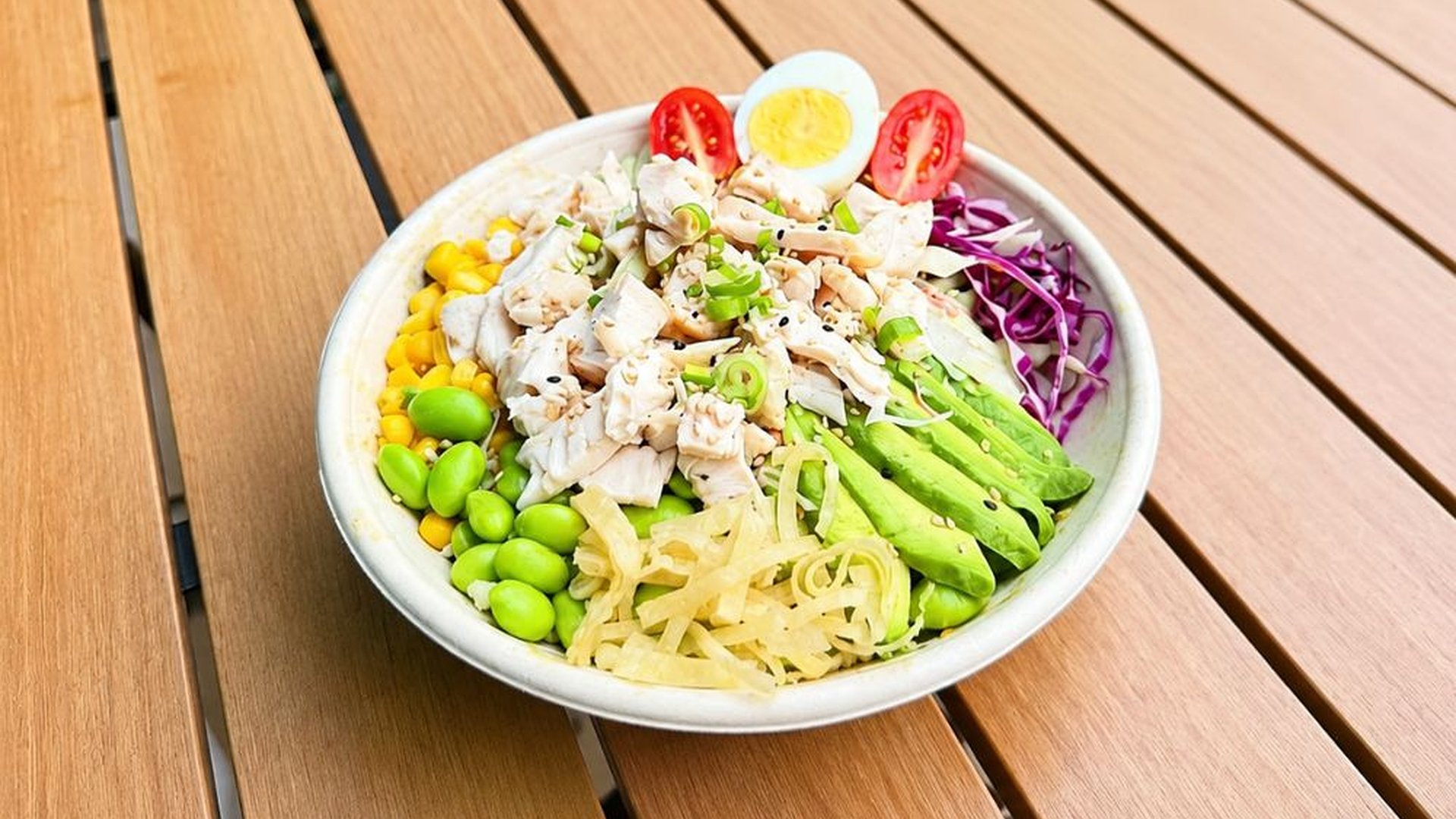 Chicken poke bowl mixed with assorted fresh vegetables at Sakana Western, a Hawaiian Restaurant in Chicago