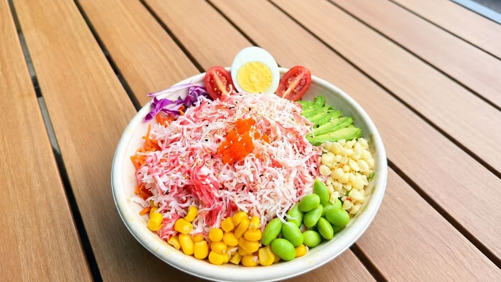 Crab stick poke bowl with avocado and mixed veggies at Sakana Western, a Hawaiian Restaurant in Chicago