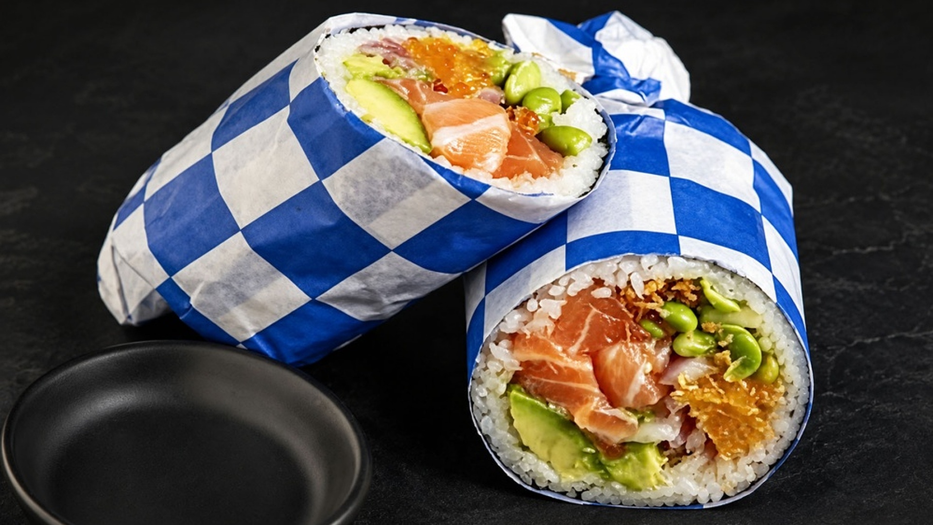 Salmon avocado sushi burrito with edamame fillings at Sakana Western, a Hawaiian Restaurant in Chicago
