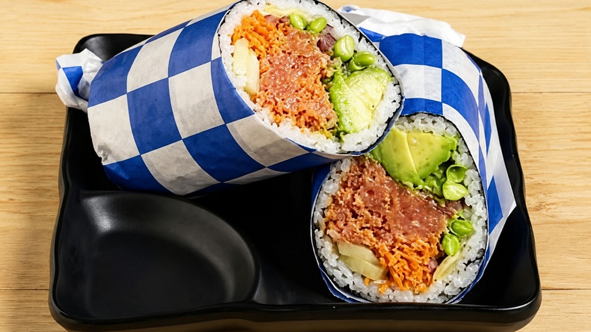 Spicy tuna sushi burrito with avocado fillings at Sakana Western, a Hawaiian Restaurant in Chicago