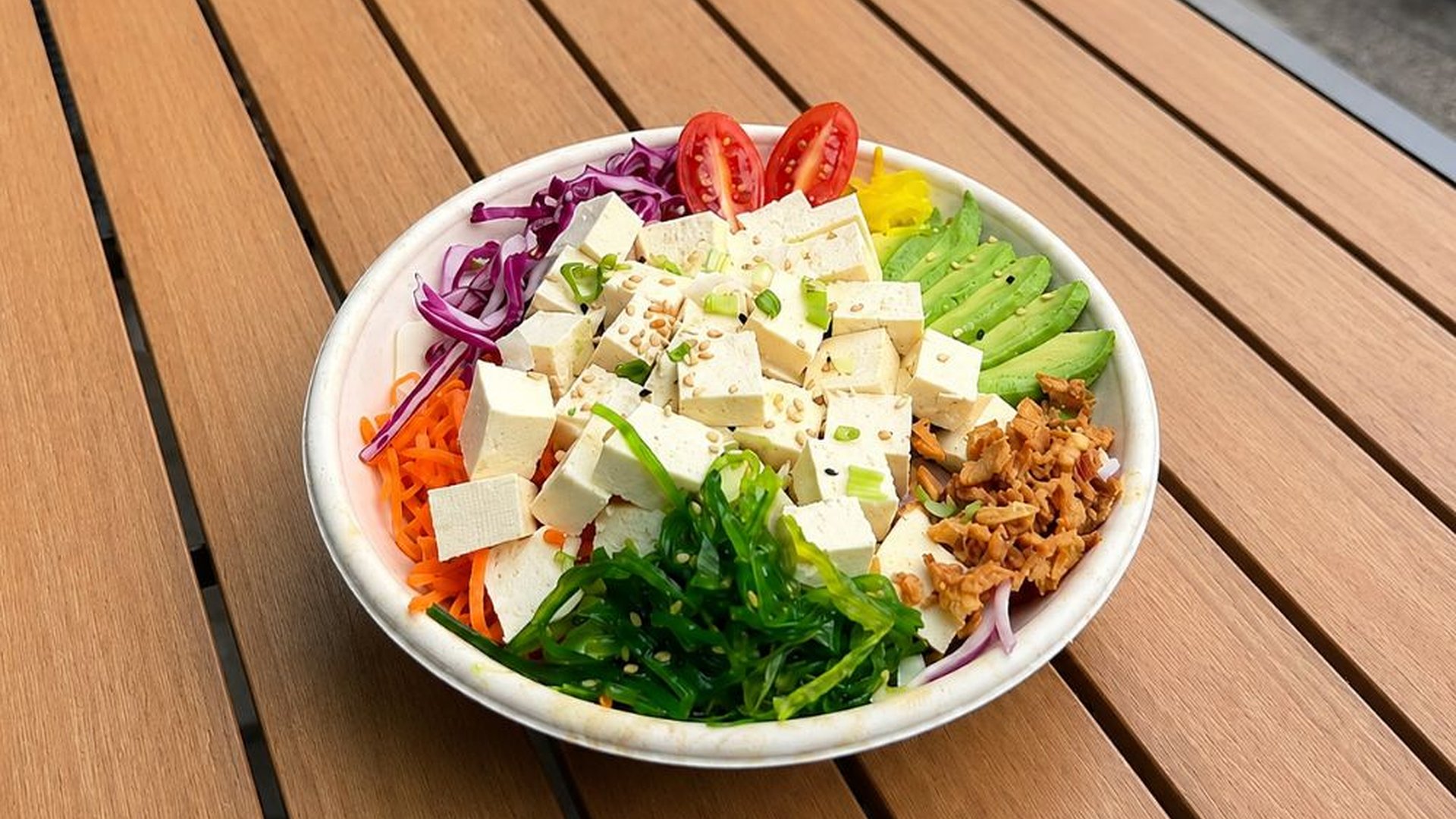 Tofu vegetarian poke bowl with seaweed and fresh greens at Sakana Western, a Hawaiian Restaurant in Chicago