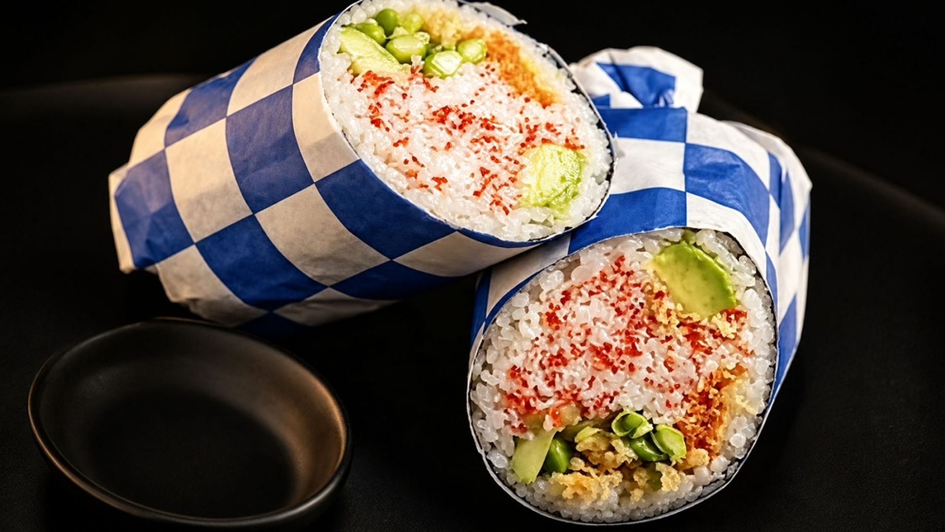 Veggie sushi burrito with avocado and crispy toppings at Sakana Western, a Hawaiian Restaurant in Chicago