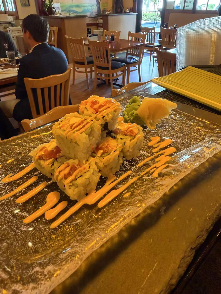 Stacked sushi roll with orange spicy sauce at Sake House 2，a Japanese Restaurant in Jacksonville