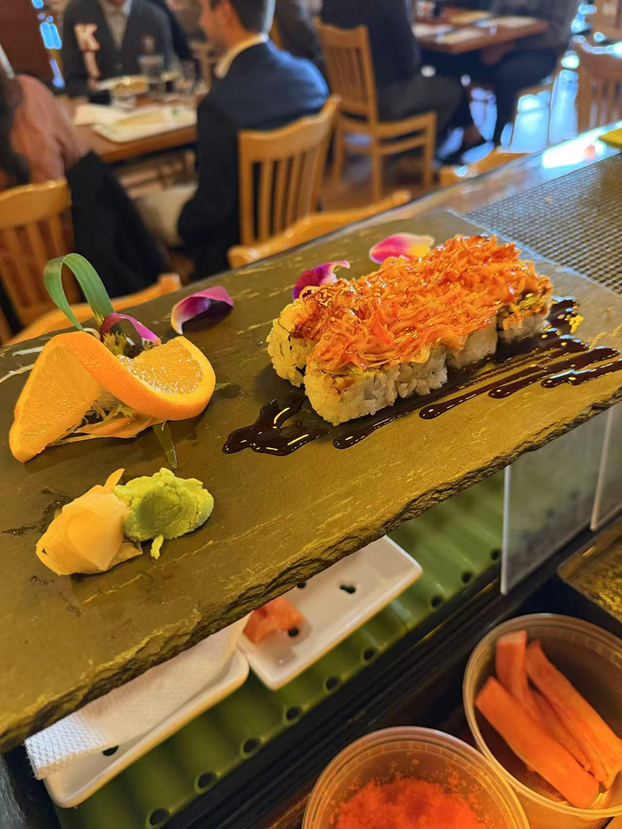 Crunchy sushi roll with orange topping and orange garnish at Sake House 2，a Japanese Restaurant in Jacksonville