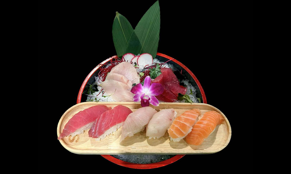 Tuna and salmon nigiri set paired with chilled sashimi and purple orchid garnish at Saki, a Sushi Restaurant in Clear Water