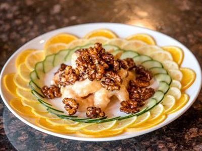 Sakura-Home-Japanese-Restaurant-Walnut-Shrimp-Rochester Marinated with Asian sweet sauce, lightly deep fried, then wok-tossed, topped with glazed walnut at Sakura Home,a Japanese Restaurant in Rochester