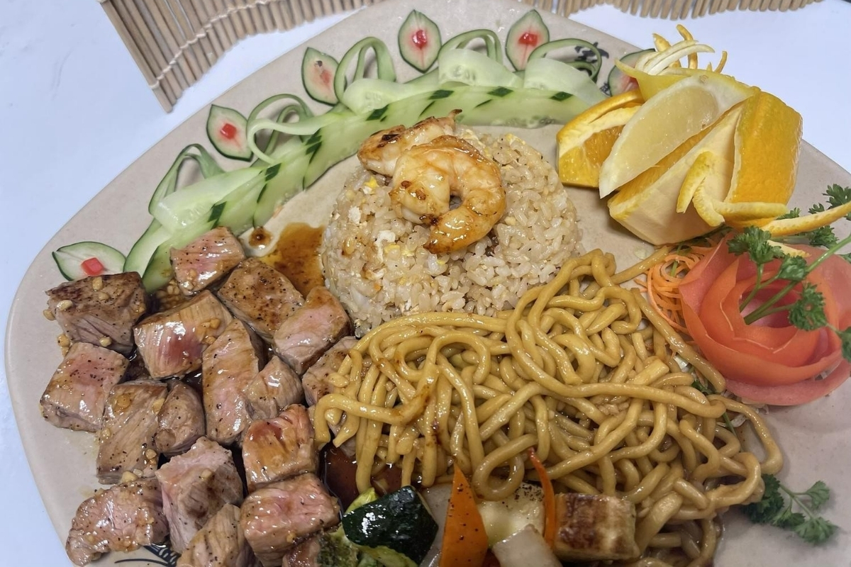 Hibachi steak shrimp combo with rice noodles and garnishes