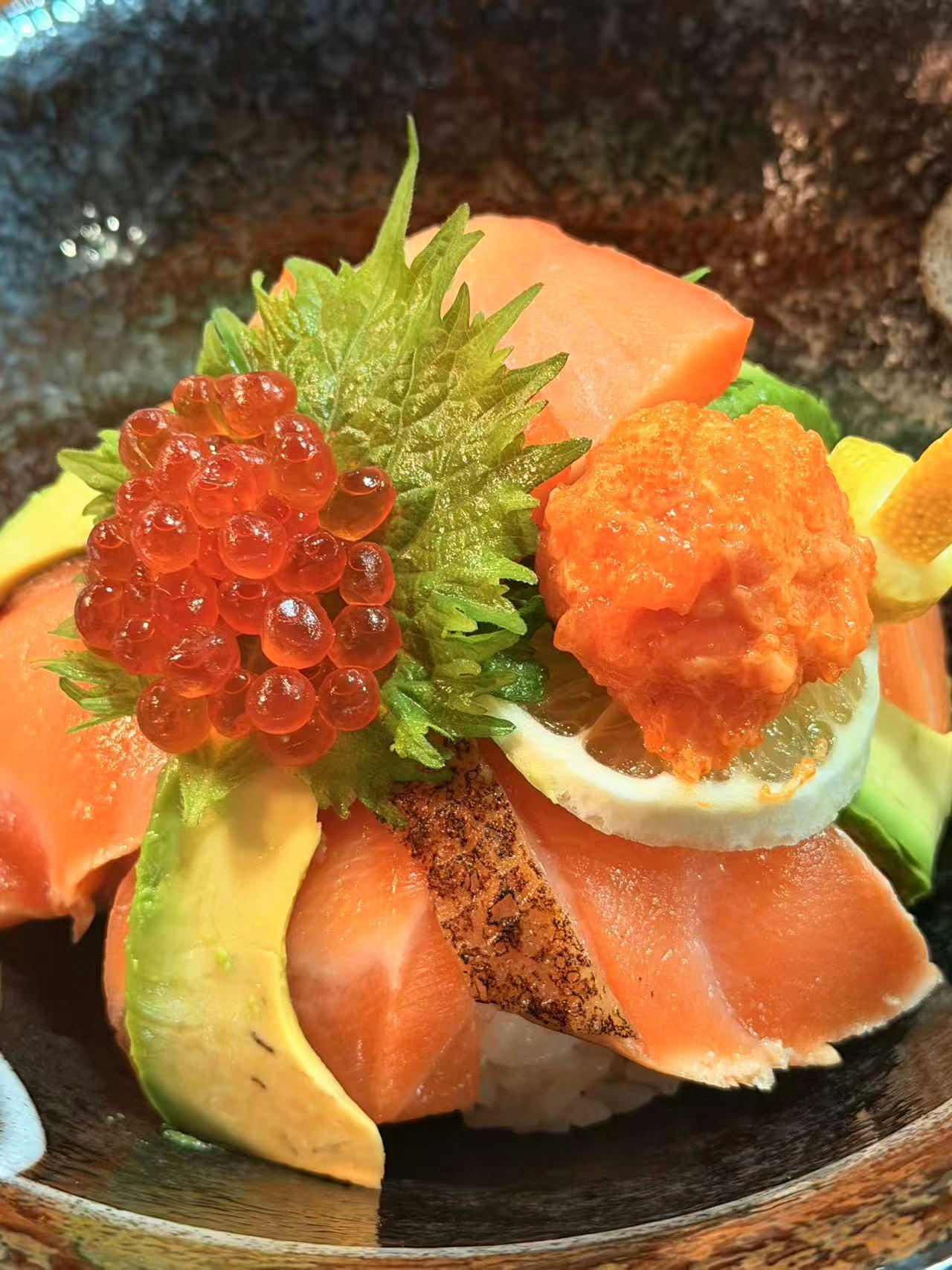Salmon donburi with ikura and uni at Sakura Sushi 88, a Japanese Restaurant in New York