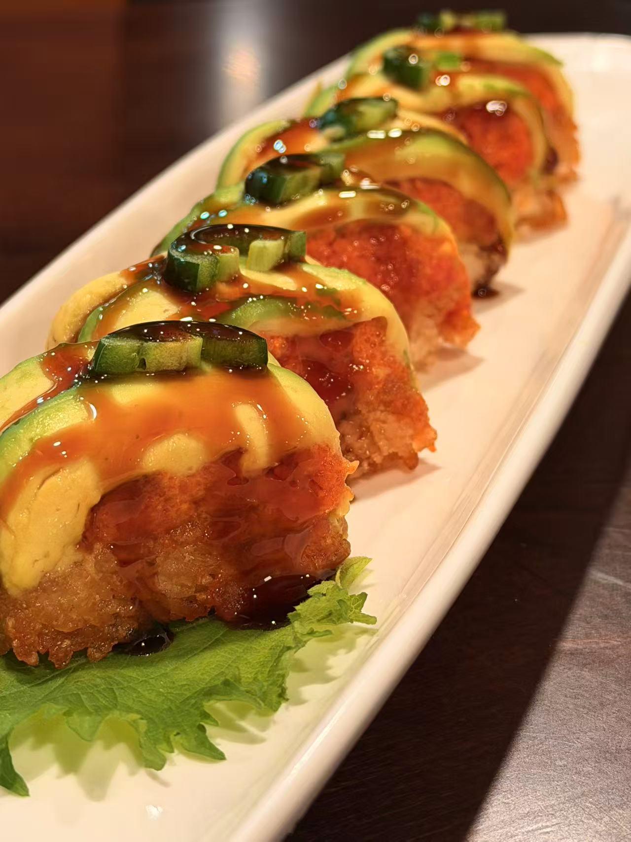 Avocado crispy sushi with special sauce at Sakura Sushi 88, a Japanese Restaurant in New York