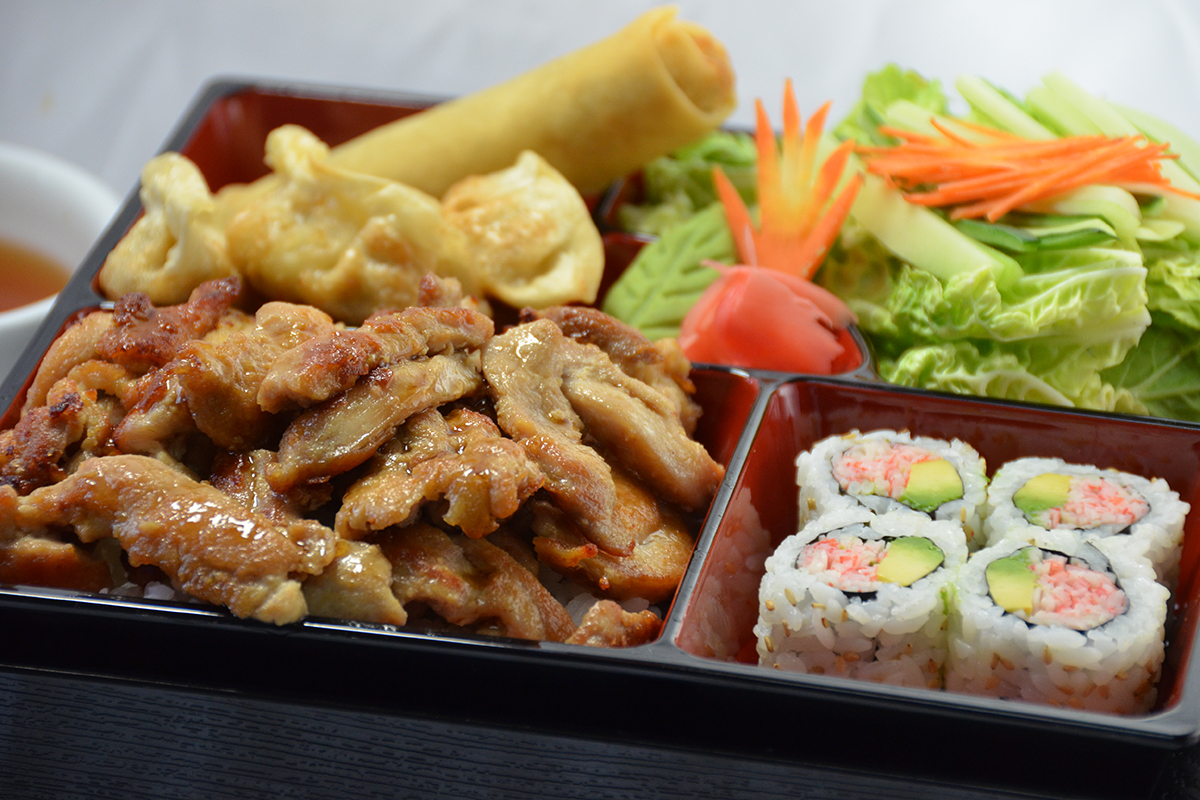 Chicken teriyaki bento box with sushi and spring rolls at Sakura Teriyaki, a Japanese Restaurant in NJ