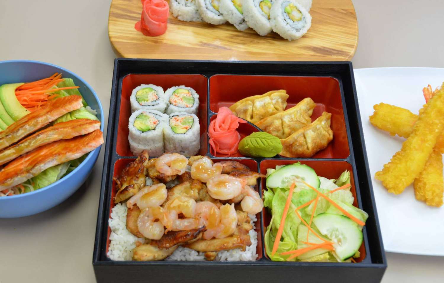 Assorted Japanese bento with sushi, gyoza, and tempura at Sakura Teriyaki, a Japanese Restaurant in NJ Assorted Japanese bento with sushi, gyoza, and tempura at Sakura Teriyaki, a Japanese Restaurant in NJ