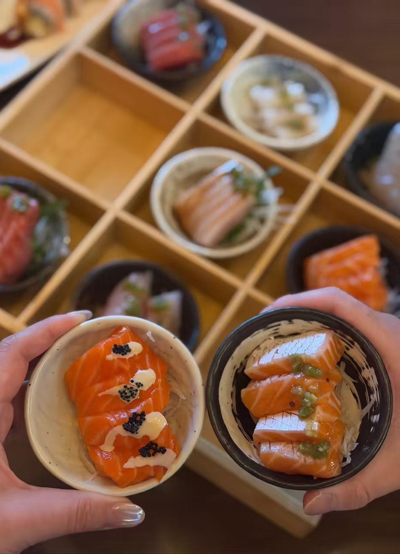Salmon bites in small bowls at Sapporo Izakaya, a Japanese Restaurant in The Woodlands