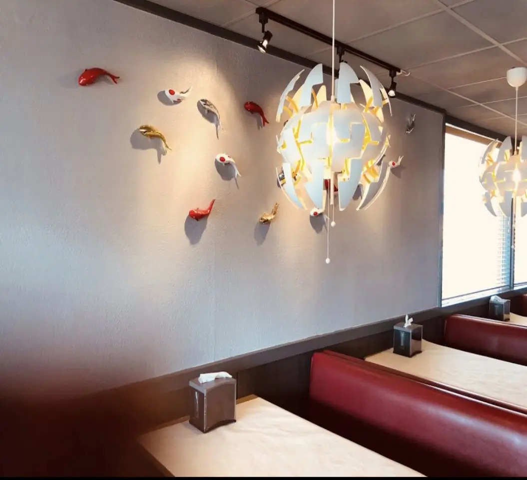 Restaurant interior featuring koi fish wall decor for an inviting ambiance at SAT Asian Seafood Restaurant & Bar in San Antonio