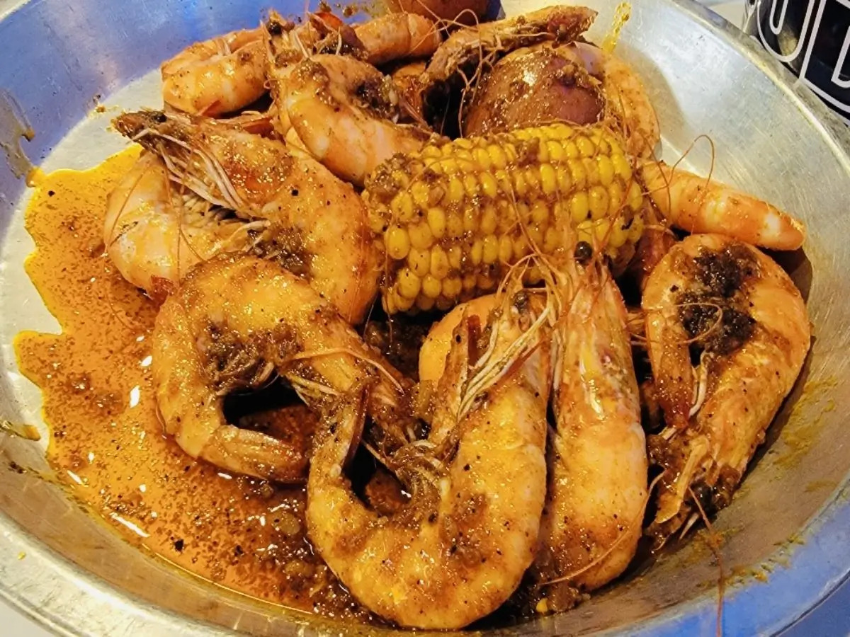 Spiced shrimp cooked with corn for a flavorful dish at SAT Asian Seafood Restaurant & Bar in San Antonio
