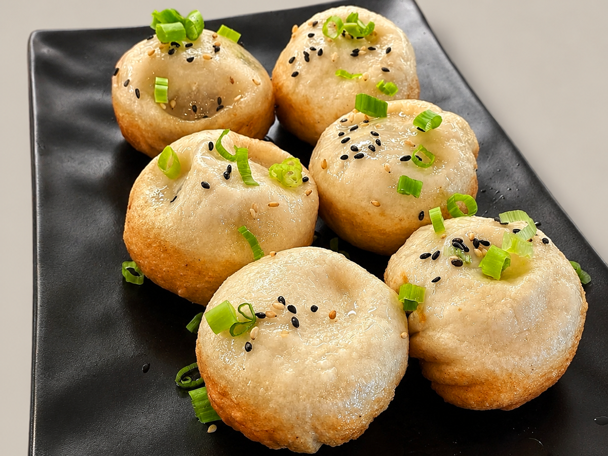 Pan fried buns topped with sesame and green onions at Savory Bun, a Chinese Restaurant in Roselle