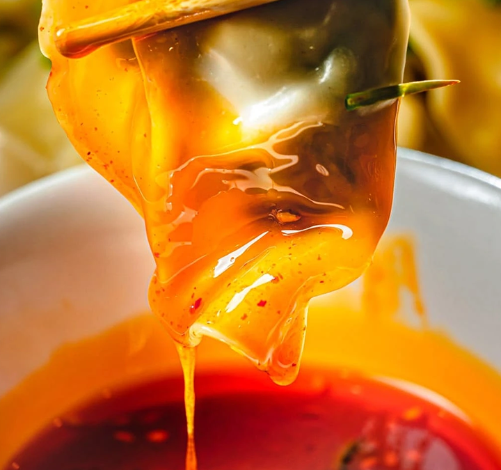 Red soup is pouring over the food at Seasons Taiwanese Eatery，a Taiwanese Restaurant in Honolulu