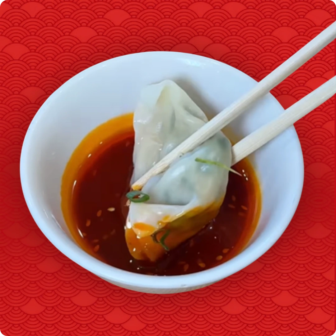 Boiled dumplings, full - shaped, served with dipping sauce at Seasons Taiwanese Eatery，a Taiwanese Restaurant in Honolulu