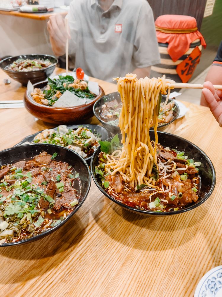 Two bowls of flavorful noodle soups on a table at Seasons Taiwanese Eatery，a Taiwanese Restaurant in Honolulu