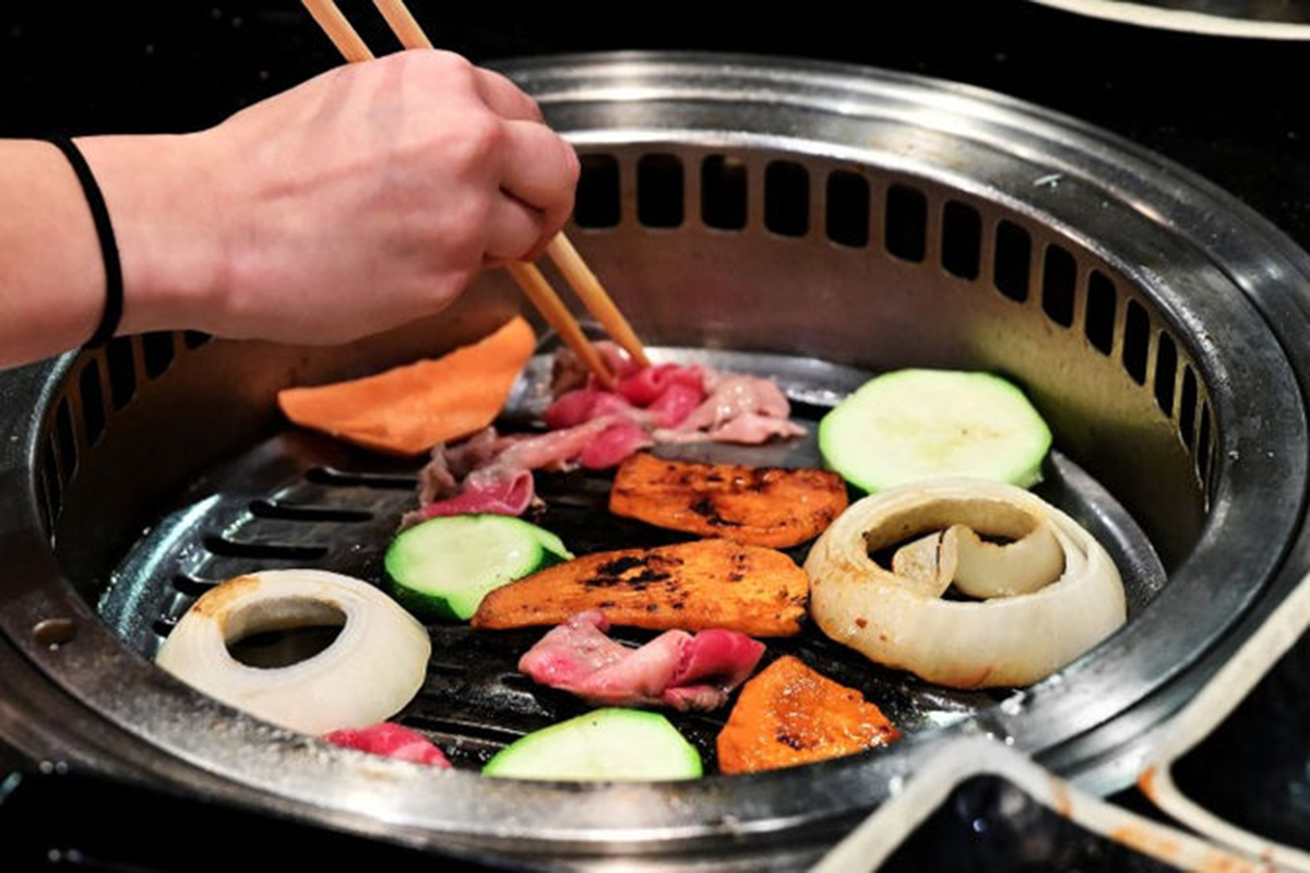 Grilling Vegetables and Meat at the Seoul Korean BBQ & Hotpot restaurant at Seoul Korean BBQ & Hotpot，a Korean Restaurant in Mason