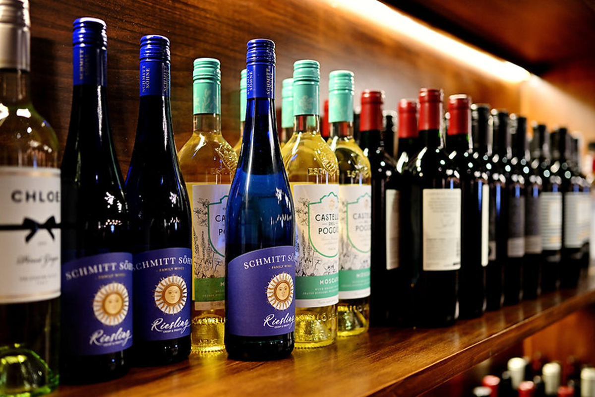 A variety of wine bottles on a shelf at Seoul Korean BBQ & Hotpot，a Korean Restaurant in Mason
