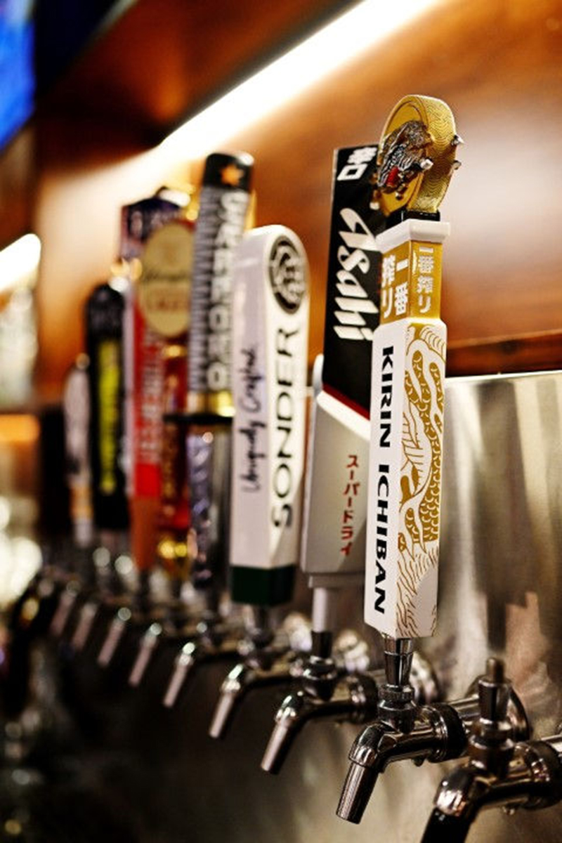 A variety of beer tap handles at Seoul Korean BBQ & Hotpot，a Korean Restaurant in Mason