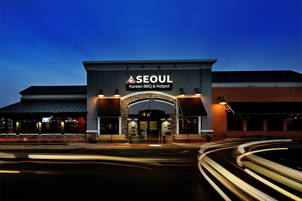 The exterior of the Seoul Korean BBQ & Hotpot restaurant at dusk