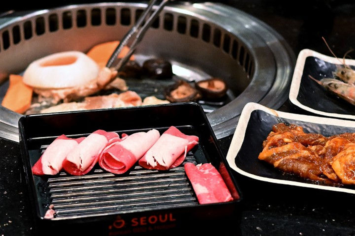 Raw meat slices on a plate ready for grilling at Seoul Korean BBQ & Hotpot，a Korean Restaurant in Mason