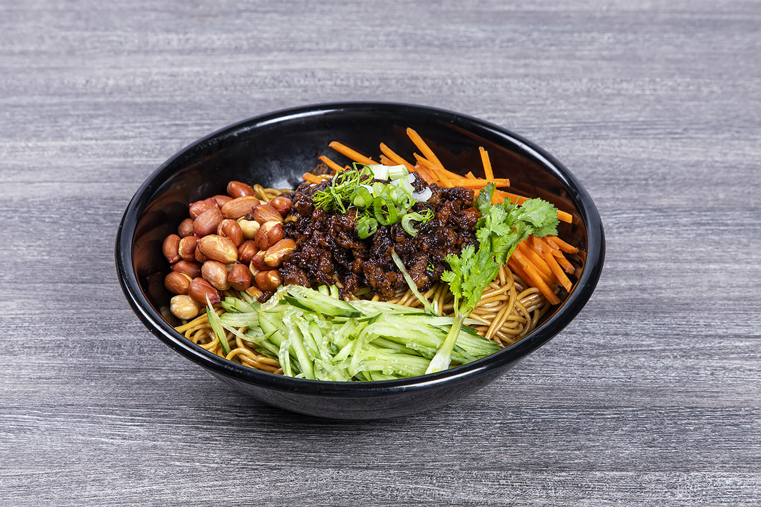 Dry tossed noodles with minced pork, peanuts and fresh shredded veggies at Shaxian Snacks, a Chinese Restaurant in Elmhurst
