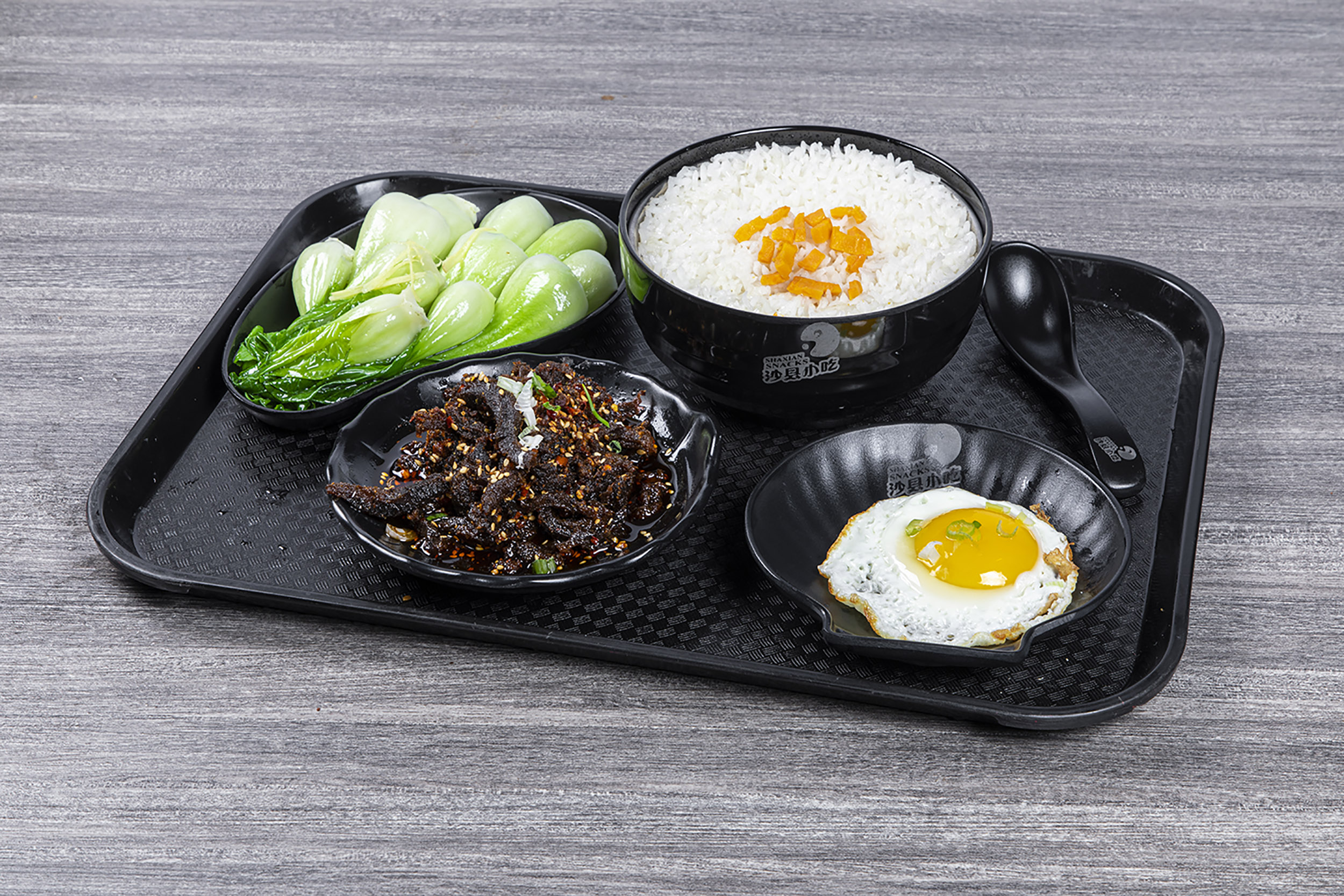 Spicy shredded beef rice set with bok choy and sunny-side egg at Shaxian Snacks, a Chinese Restaurant in Elmhurst