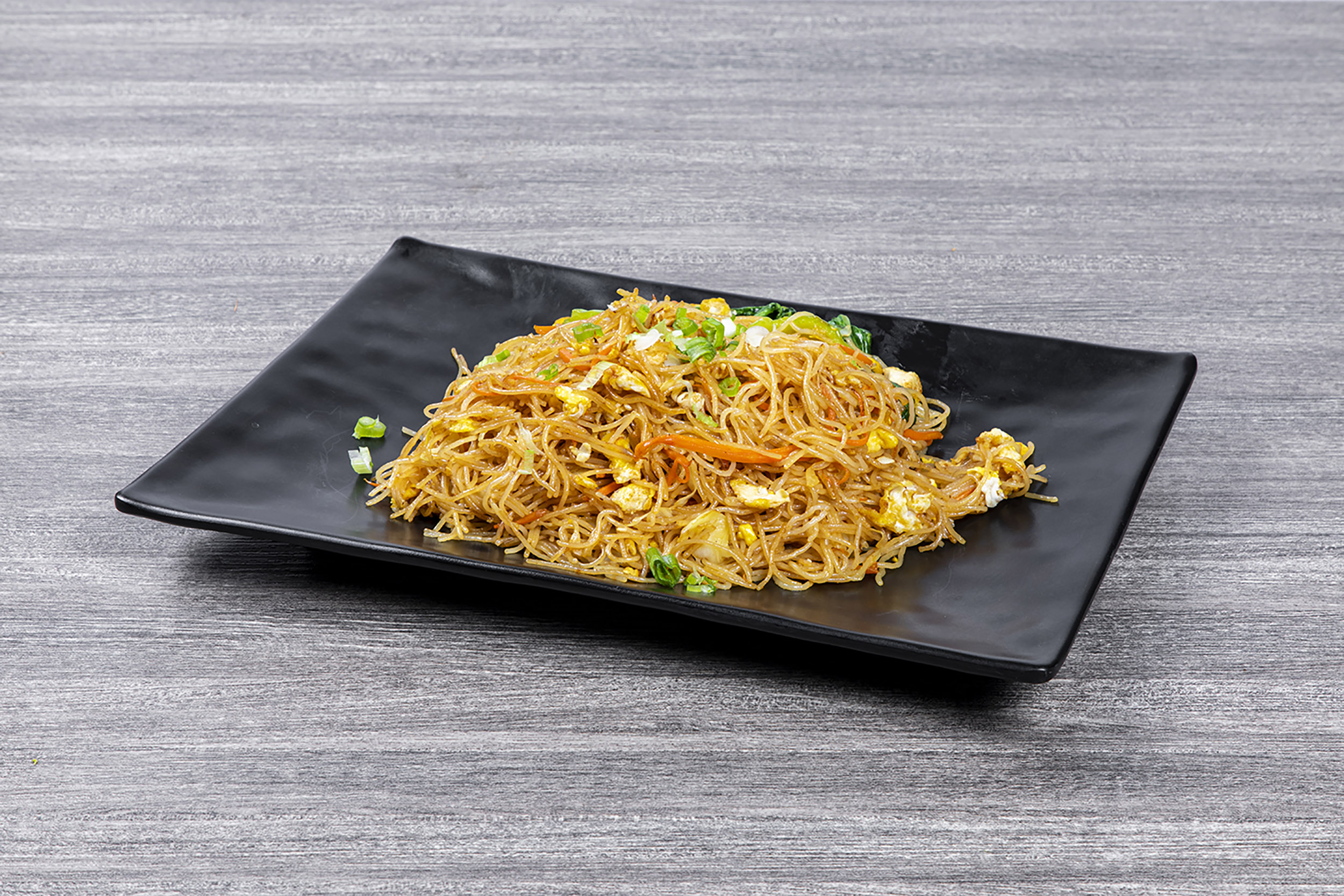 Stir-fried thin rice noodles with egg, carrot and green onion at Shaxian Snacks, a Chinese Restaurant in Elmhurst