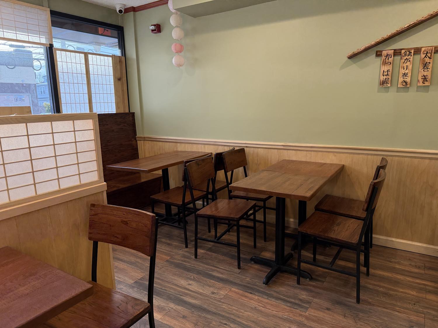 Casual tables with paper lanterns and Japanese wall signs at Shogun, a Japanese Restaurant in Rutherford