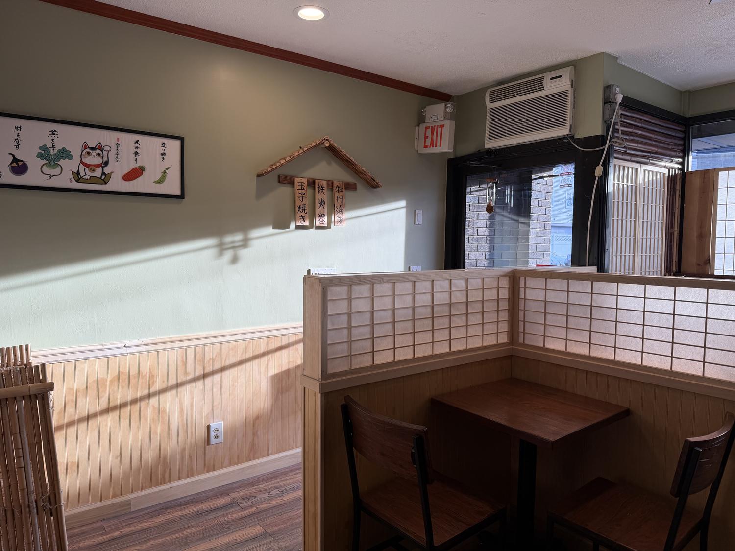 Cozy booth with traditional Japanese wall art at Shogun, a Japanese Restaurant in Rutherford
