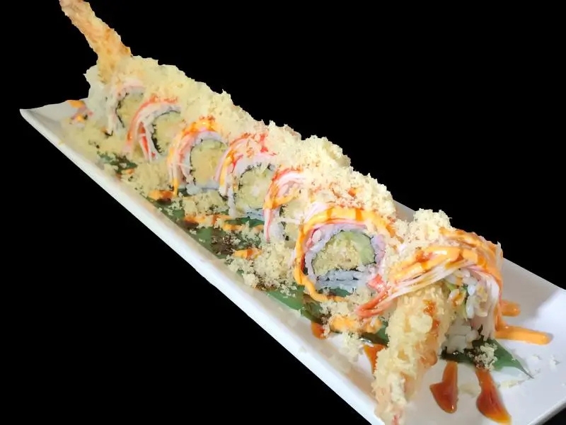 Deep-fried crispy tempura shrimp sushi roll with drizzled sauces at Shoku Sushi & Bar, a Japanese Restaurant in Monroe